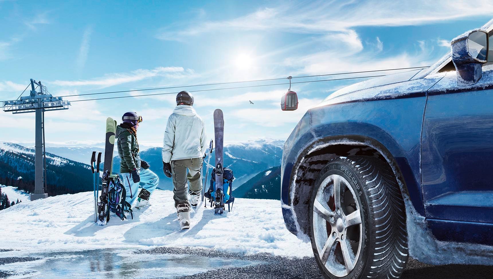 Semperit SPEED-GRIP 5 keyvisual couple skiing in front of a Cable railway